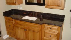 granite-black-copper-accents-bathroom-cedar-cabinets granite-black-copper-accents-bathroom-cedar-cabinets